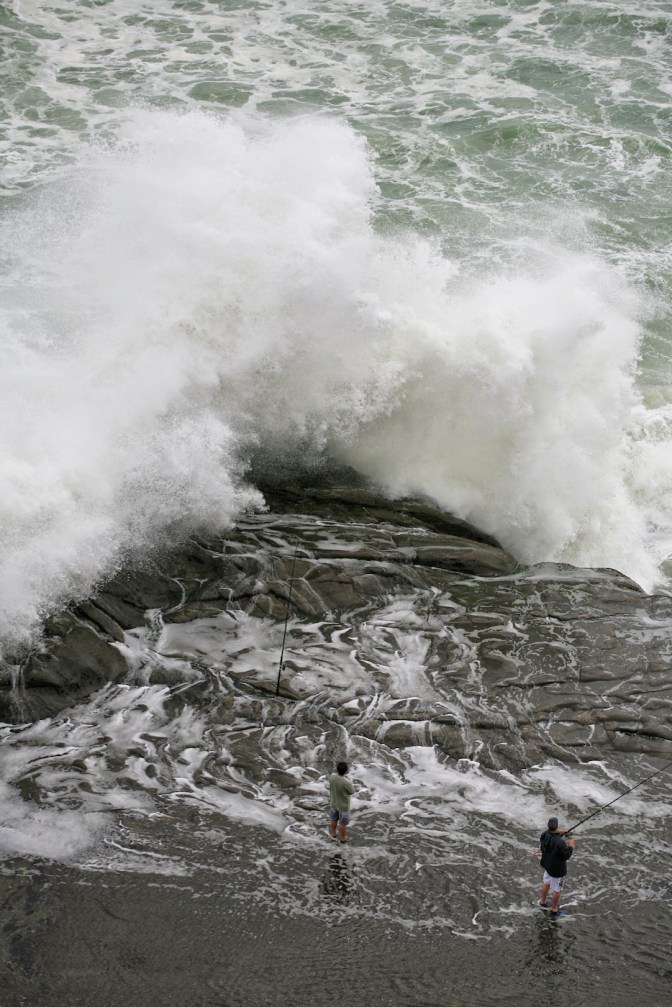 Hazardous fishing at Muriwai Regional Park near Auckland
