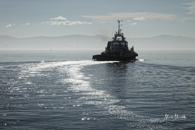Tugboat heads out to sea, Cape Town